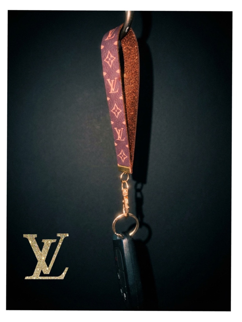 Louis Vuitton Monogram Wristlet Strap in Brown and Pink.